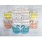 Swan paper shapes in pastel colors with sheet music pattern.